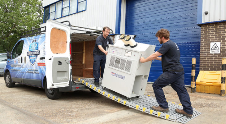 Two Men on Roll-a-Ramp attached to van